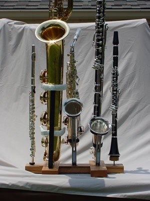 the ultimate woodwind doubler's stand, baritone sax stand, alto sax stand, bass clarinet stand, clarinet stand, flute stand