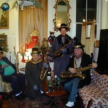My former quartet at Christmas taking a break from a street stroll at a local antique shop.

I play bari.